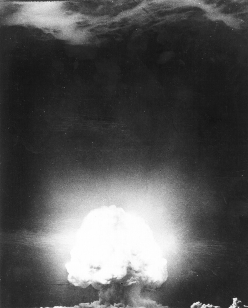 Trinity nuclear test, 1945. US Department of Energy photograph, public domain / Wikimedia Commons. An analogy of risk, not a technical equivalence with AI.